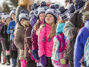 Kids wait for a cross-country ski relay race at Mount View School in Calgary, Alta., on Tuesday, Jan. 26, 2016. The Calgary Fire Department and Calgary Police Service, along with a pair of Olympians, went head-to-head in a relay race for an announcement by AltaGas to support Cross Country Ski de Fond Canada's Ski at School program for the next three years. Lyle Aspinall/Postmedia Network