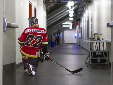 The Calgary Inferno's Hayley Wickenheiser  takes a moment in the hallway outside the locker room during the first intermission against Toronto Furies during CWHL action at Winsport in Calgary, on January 17, 2016.