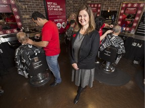 Alison Trollope, director of communications and investor education with the Alberta Securities Commission, is photographed as they kick off an investment fraud awareness campaign in Denim and Smith barber shop at Bankers Hall in Calgary, on November 5, 2015.