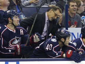 Columbus Blue Jackets coach John Tortorella, center, reacts to a penalty between Boone Jenner, left, and Jared Boll during the second period an NHL hockey game against the  Winnipeg Jets  in Columbus, Ohio, Saturday, Oct. 31, 2015. Winnipeg won 3-2.