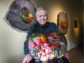 John Webster, owner of Webster Galleries Inc. on 11 Ave S.W. with a large piece of ammolite fossil.