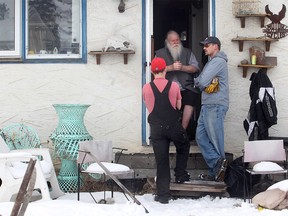 Scott Herzog, right, and Dave McPherson of We R Movers in the backyard of Kelly Jay's Penbrooke Meadows home on Wednesday, Jan. 13, 2016. The men were volunteering a hand cleaning out the backyard for the former singer for iconic Canadian rock band Crowbar, and a well known hoarder, whose yard has been the subject of scrutiny by the City of Calgary.