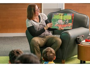 Kids listen to a reading of A Twisted Tale by the book's author Carolyn Fisher at the first annual TD book drive in support of the Calgary Public Library.
