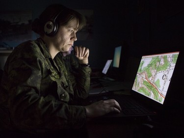 Master Corporal Bonnie Critchley participates in virtual training and battle procedure exercises with other Canadian Force colleagues at Metawa Armoury in Calgary, on January 17, 2016.