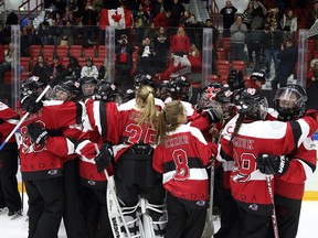 Canada's U21 ringette team, of which Calgarians Justine Exner and Ellen Hoban were members, celebrate after winning the gold medal in Helsinki, Finland last Sunday.