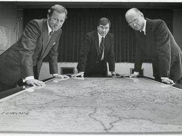 Norm Robertson, left, Ron Southern, and Cam Richardson, right, view map of Europe in the ATCO boardroom.
Photo: Calgary Herald file photo -- originally published July 3, 1980.