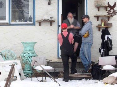 Scott Herzog, right, and Dave McPherson of We R Movers in the backyard of Kelly Jay's Penbrooke Meadows home Wednesday January 13, 2016. The men were volunteering a hand cleaning out the backyard for the former singer for iconic Canadian rock band Crowbar, and a well known hoarder, whose yard has been the subject of scrutiny by the City of Calgary.