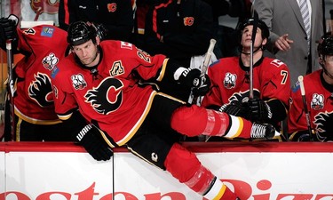 Robyn Regehr #28 of the Calgary Flames jumps over the bench for a shift against the Pittsburgh Penguins on January 13, 2010  in Calgary.