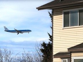 A jet comes in low over the Whitehorn neighbourhood Wednesday, Jan. 27, 2016. Mark Deitz lives nearby and is a vocal critic of the airport noise pollution in the area.