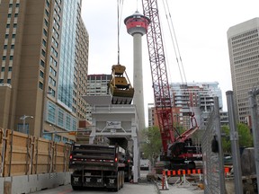 Professional Excavators used a clam shell bucket to continue digging the deepest hole in Calgary construction business. The company is working to dig 28.8m, equivalent to 10 floors, down for the Telus Sky Project.