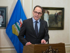Alberta Finance Minister Joe Ceci speaks to the media at Government House in Edmonton on Jan. 18.