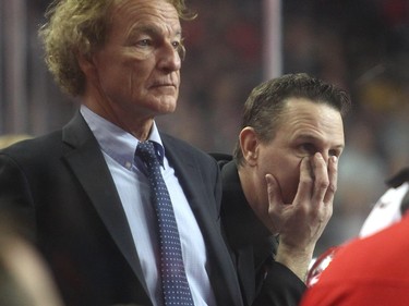 Calgary Roughnecks head coach Curt Malawsky, right, grimaces from bench alongside assistant Bob McMahon during their 10-8 season opening loss to the Saskatchewan Rush Saturday January 2, 2015 at the Saddledome.