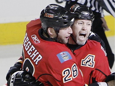 April 13, 2008: Calgary Flames Owen Nolan and Robyn Regehr celebrate after Nolan scored the game winning goal.