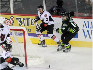 Hitmen Jake Bean, 2, and Oil Kings Dario Meyer race for the puck as the Calgary Hitmen played host to the Edmonton Oil Kings on Saturday, January 16, 2016 at the Saddledome.