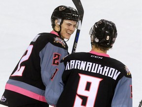 Calgary Hitmen defenceman Jake Bean, left, seen celebrating a goal with teammate Pavel Karnaukhov earlier this season, could go in the first round of the 2016 NHL Entry Draft.