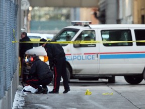 Police at the scene of the murder of Mark Kim, an FOB Killers member killed in a downtown alley on Dec. 31, 2007. Later that day, Vinh Tung Truong was involved in a shooting that targeted two rival FOB gang members as revenge for Kim's killing. Truong is due to be released from prison in February.