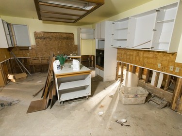 A torn-up kitchen sits inside a flood-damaged home on Riverdale Ave SW in Calgary, Alta., on Friday, Jan. 29, 2016. The province showed media around two of the 17 homes purchased by the government after the 2013 flood that are slated for demolition as a lead-up to a community discussion about what to do with the lots once they're vacant. Lyle Aspinall/Postmedia Network