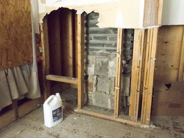 A torn-up wall sits inside a flood-damaged home on Riverdale Ave SW in Calgary, Alta., on Friday, Jan. 29, 2016. The province showed media around two of the 17 homes purchased by the government after the 2013 flood that are slated for demolition as a lead-up to a community discussion about what to do with the lots once they're vacant. Lyle Aspinall/Postmedia Network