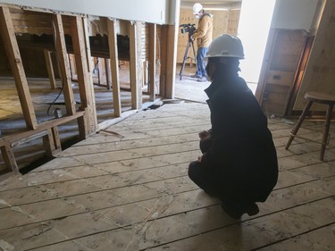 Municipal Affairs minister Danielle Larivee tours a flood-damaged home on Riverdale Ave SW in Calgary, Alta., on Friday, Jan. 29, 2016. The province showed media around two of the 17 homes purchased by the government after the 2013 flood that are slated for demolition as a lead-up to a community discussion about what to do with the lots once they're vacant. Lyle Aspinall/Postmedia Network