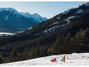 Two Calgary photographers were shooting an assignment in Banff on December 30, 2015, when they saw this couple get engaged. They snapped some photos, including this one, and are now searching for the couple so they can have the photos.