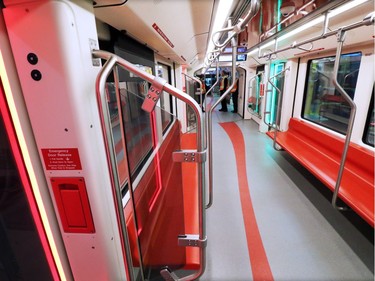 The interior of  Calgary Transit's new  "Mask"  S200 CTrain car features improved seating and red and green LED lighting around the doors.