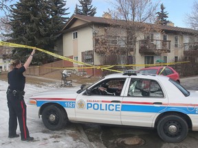 Police tape surrounds the end unit of a townhouse complex at 446 Ranchlands Grove NW Monday morning, February 1, 2016 as the death of a little boy is investigated.