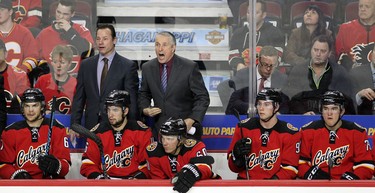 Calgary Flames head coach Bob Hartley yells at the bench during first period action in NHL hockey action at the Scotiabank Saddledome in Calgary, Alta. on Tuesday February 9, 2016. Leah Hennel/Postmedia