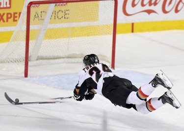 Calgary Hitmen Carson Twarynski, scores his third goal of the game on an empty net against Red Deer Rebels in WHL action at the Scotiabank Saddledome in Calgary, Alberta, on Friday, February 12, 2016. Leah Hennel/Postmedia