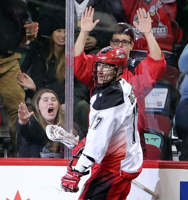Fans cheer on Calgary Roughnecks Curtis Dickson after he scored on Colorado Mammoth during game action at the Scotiabank Saddledome in Calgary, Alta. on Saturday February 13, 2016. Leah Hennel/Postmedia