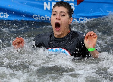 Calgary Police recruit Karmen Brown reacts after jumping into Arbour Lake during Polar Plunge in support for Special Olympics Albarta in Calgary, Ab., on Sunday February 28, 2016. Leah Hennel/Postmedia