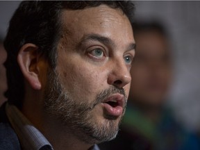 EDMONTON, ALBERTA: March 31, 2015 -Gil McGowan, President Alberta Federation of Labour, speaks at the temporary foreign worker rally held at the Panciteria De Manila restaurant on March 31, 2015. Topher Seguin/Edmonton Journal