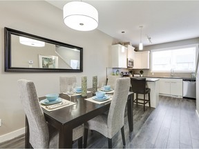 The dining area in the Aspen interior unit show home at Arrive at Skyview Ranch Arbours by Partners Development Group.