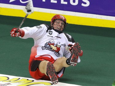 Calgary Roughnecks Jon Harnett fires a pass down field as he falls against the Saskatchewan Rush in NLL action at the Scotiabank Saddledome in Calgary, Alta. on Sunday February 28, 2016. Mike Drew/Postmedia