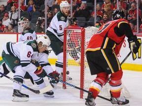 Mikael Backlund of the Flames scores a goal against the Minnesota Wild during their game at Scotiabank Saddledome on Wednesday night.