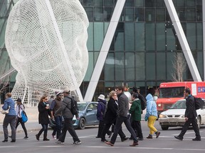 Pedestrians in the downtown core in Calgary on Tuesday, Feb. 16, 2016.