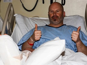 Todd Wyatt smiles in the hospital despite suffering a broken leg in an avalanche near Bow Hut on the Wapta Icefields on Friday, Feb. 12, 2016.
