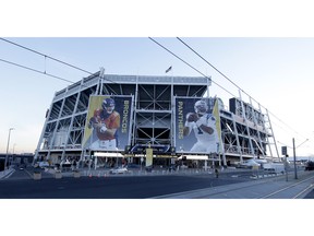 Banners for the Denver Broncos and Carolina Panthers hang outside Levi's Stadium in advance of Sunday's NFL Super Bowl 50 football game Friday, Feb. 5, 2016, in Santa Clara, Calif.