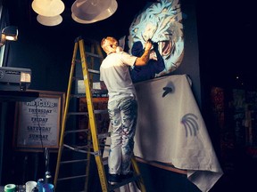 Ben Tour creates one of his two murals at the Hi-Fi Club.