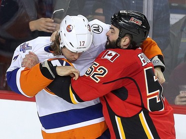 Brandon Bollig of the Calgary Flamesfights Matt Martin of the New York Islanders in the first period at the Saddledome Thursday night February 25, 2016.