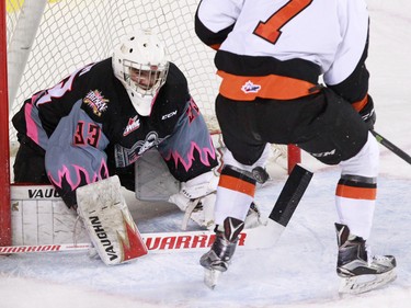 The Medicine Hat Tigers' Matthew Bradley wasn't able to get this rebound past Calgary Hitmen goaltender Kyle Dumba during WHL action against the Medicine Hat Tigers at the Scotiabank Saddledome on Sunday February 21, 2016.