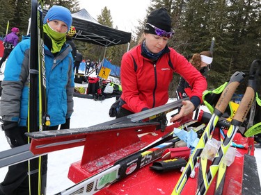 Ski team members have their wax fine-tuned before the Kananaskis Ski Marathon (a.k.a. the Cookie Race) the 39th edition of the annual loppet in Peter Lougheed Provincial Park on Saturday February 27, 2016.