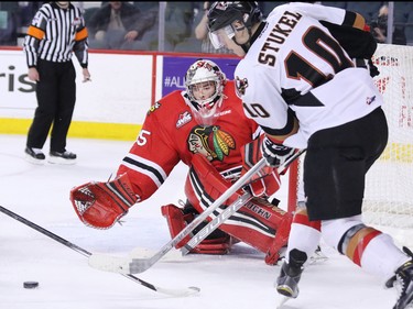 Calgary Hitmen Jakob Stukel lines up to score on Portland Winterhawks goaltender Michael Bullion during third period WHL action at the Scotiabank Saddledome on Tuesday February 23, 2016. Calgary won the game 5-2.