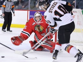 Calgary Hitmen's Jakob Stukel lines up a shot to score on Portland Winterhawks goaltender Michael Bullion during third period WHL action at the Scotiabank Saddledome on Tuesday.