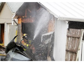 Calgary firefighters battle a garage fire in Ramsay on Saturday morning February 20, 2016.