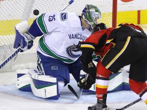 Calgary Flames Josh Jooris puts the puck past Vancouver Canucks Jacob Markstrom in NHL hockey action at the Dome on Friday.