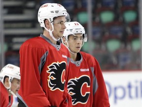 Calgary Flames Sean Monahan, left, and Johnny Gaudreau during practice on Wednesday February 10, 2016. Leah Hennel/Postmedia