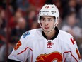 GLENDALE, AZ - FEBRUARY 12:  Johnny Gaudreau #13 of the Calgary Flames awaits a face off during the second period of the NHL game against the Arizona Coyotes at Gila River Arena on February 12, 2016 in Glendale, Arizona.