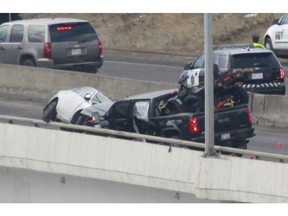 Calgary Police investigate at the scene of a fatal accident on Wednesday February 18, 2015 near 37 St south of 130 Ave SW. One man was deceased on scene and according to police occupants from the truck fled the scene. Jim Wells//Postmedia