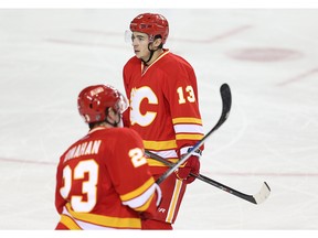 Calgary Flames Johnny Gaudreau and Sean Monahan after giving up a goal to the Ottawa Senators during NHL hockey in Calgary, Alta., on Saturday, February 27, 2016.