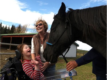 Emily Pitchers, 16, is introduced to Diva by Lorraine Seth, one of the amazing therapy horses at Whispering Equine.